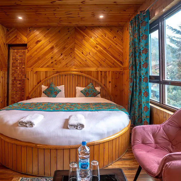 Riverside Room bed view - Pahalgam Resort & Cottages
